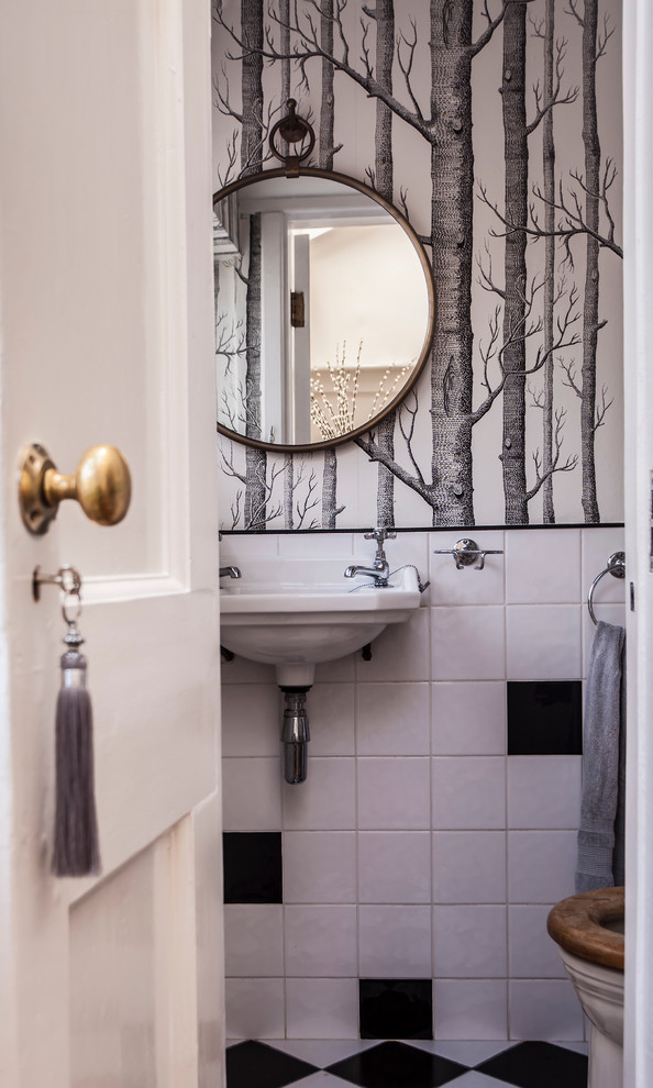 Inspiration for a small traditional powder room in Hampshire with black and white tile, ceramic tile and ceramic floors.