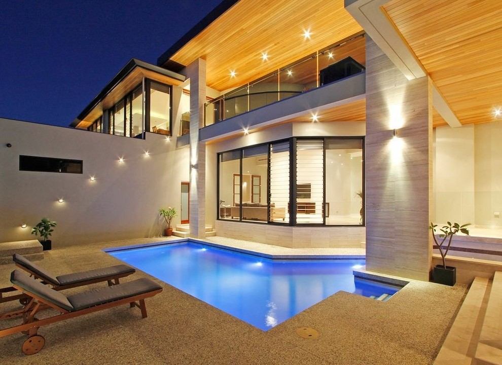 This is an example of a contemporary courtyard custom-shaped pool in Perth.
