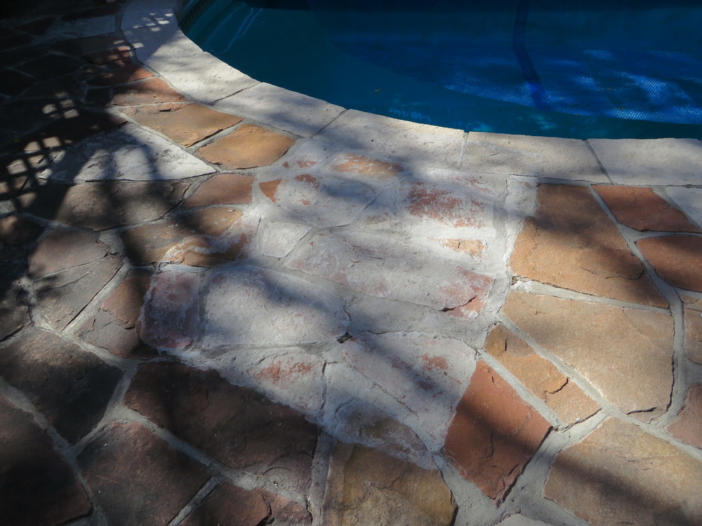 Mortar on flagstone pool deck. How to remove or stain?