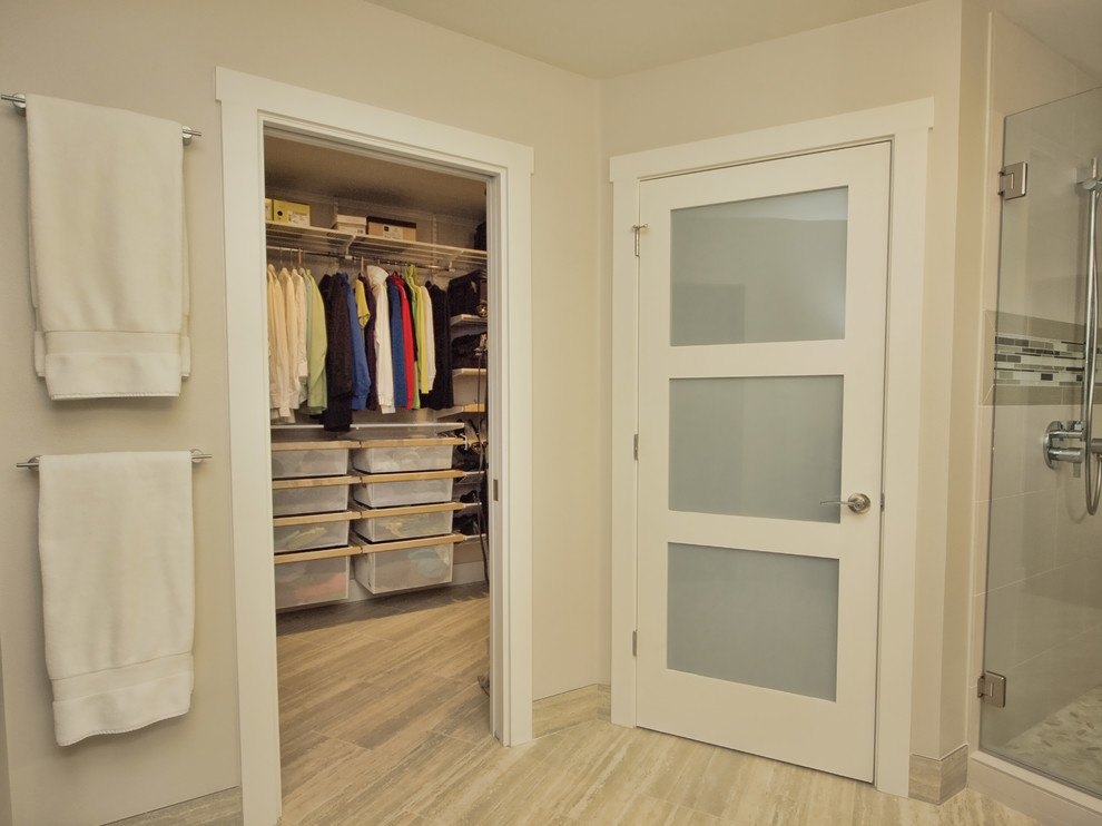 Design ideas for a large modern gender-neutral walk-in wardrobe in Austin with open cabinets, porcelain floors and beige floor.