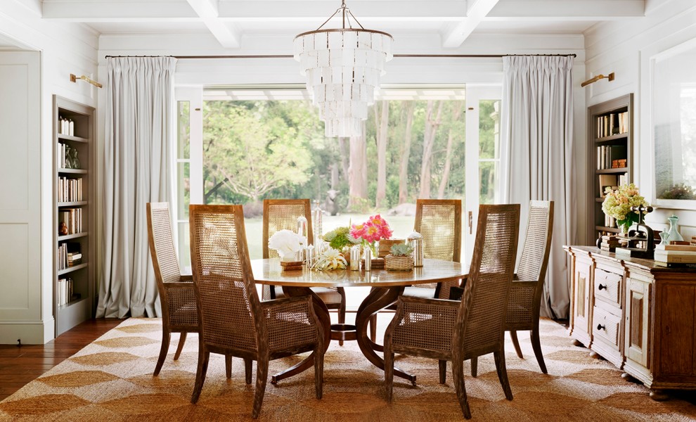 Photo of a traditional dining room in San Francisco with white walls and dark hardwood floors.