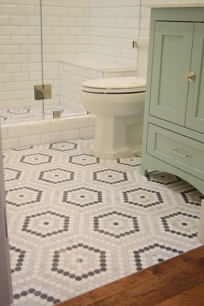 Design ideas for an arts and crafts bathroom in San Diego with shaker cabinets, green cabinets, an alcove shower, a one-piece toilet, white tile, ceramic tile, grey walls, mosaic tile floors, an undermount sink, engineered quartz benchtops, grey floor and a hinged shower door.