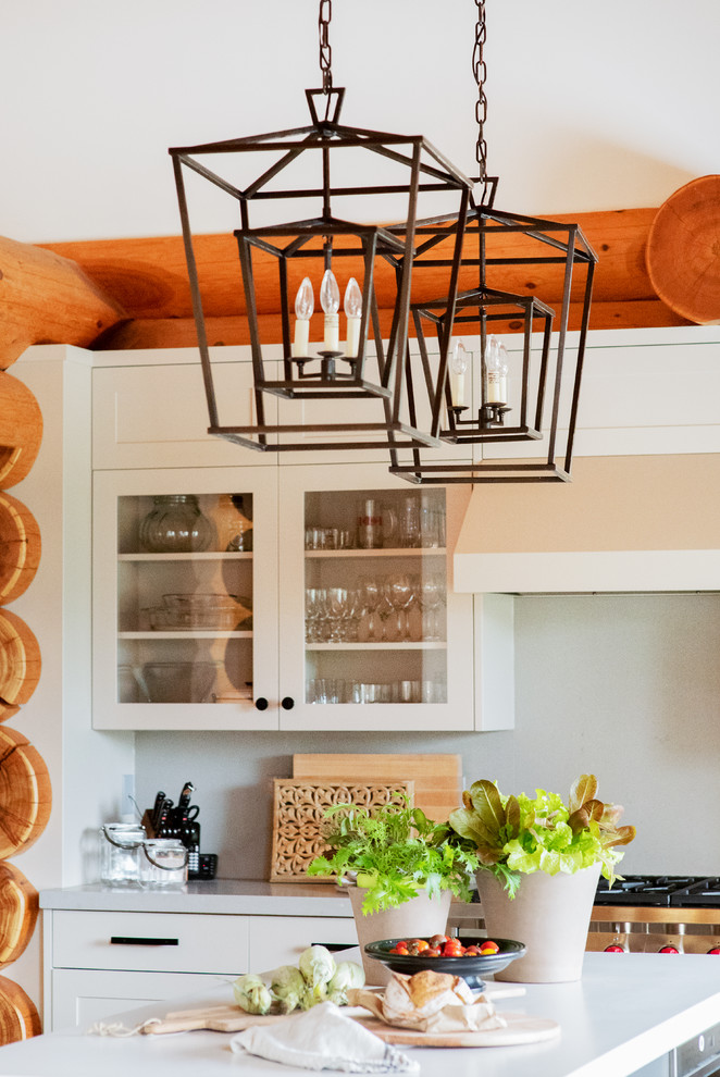 Example of a large transitional u-shaped light wood floor and brown floor open concept kitchen design with an undermount sink, shaker cabinets, gray cabinets, quartz countertops, gray backsplash, stone slab backsplash, paneled appliances, an island and gray countertops