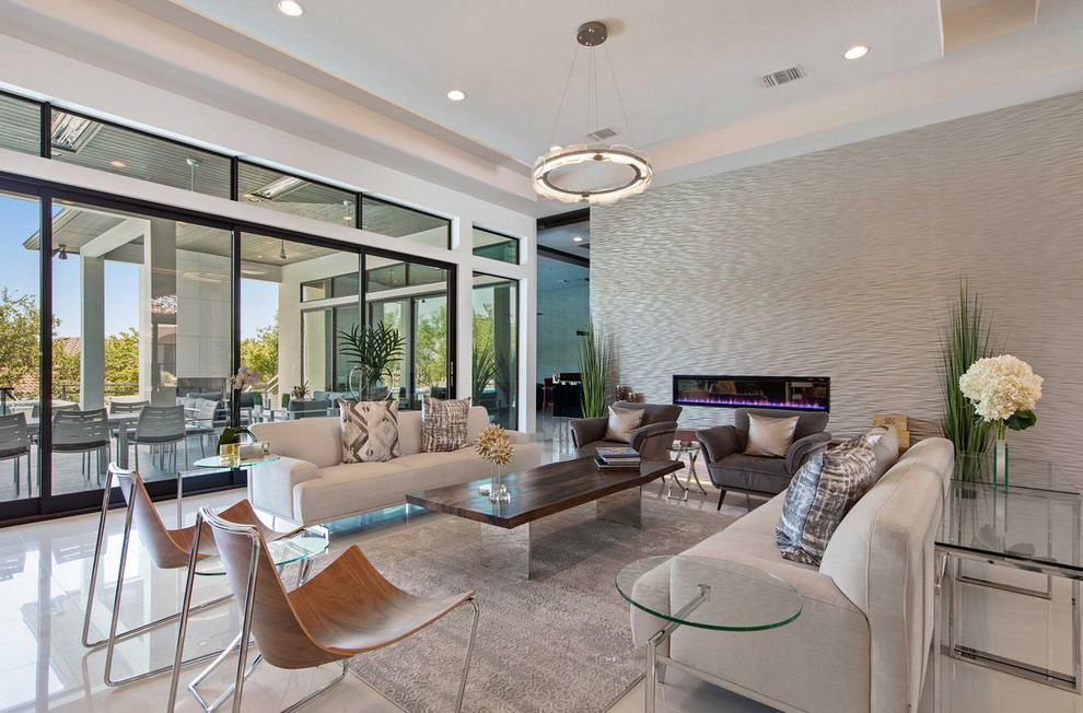 This is an example of a large contemporary open concept living room in Austin with white walls, a ribbon fireplace, a tile fireplace surround and white floor.
