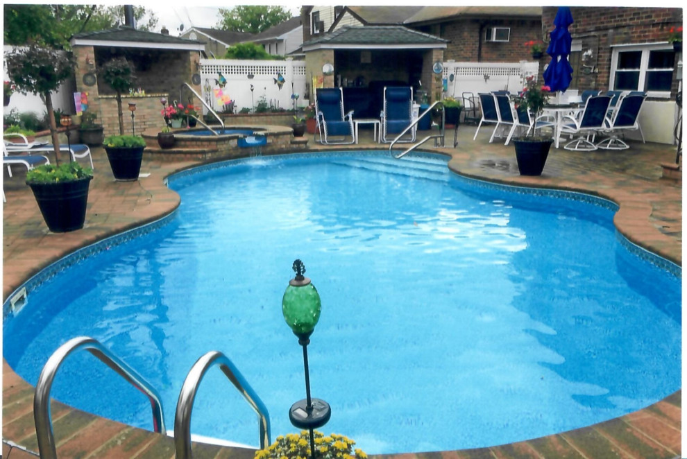 Pool with Whirl pool spill over, outdoor kitchen, outdoor bar, Pergola& Patio