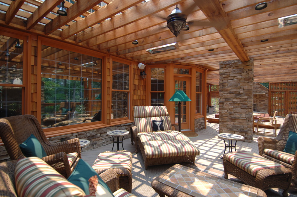 Huge mountain style backyard outdoor kitchen deck photo in Atlanta with a pergola