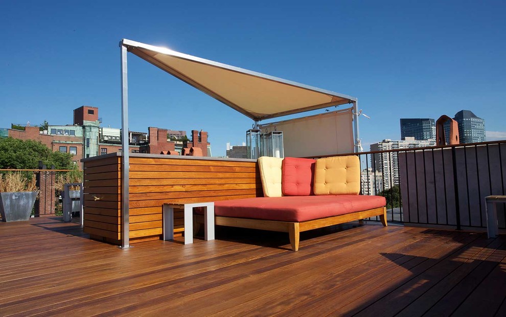 Photo of a mid-sized contemporary rooftop deck in Boston with an outdoor kitchen and a pergola.