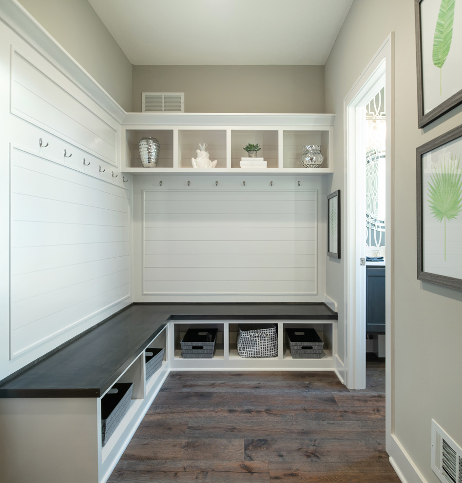 Mid-sized arts and crafts mudroom in Kansas City with beige walls, medium hardwood floors and brown floor.