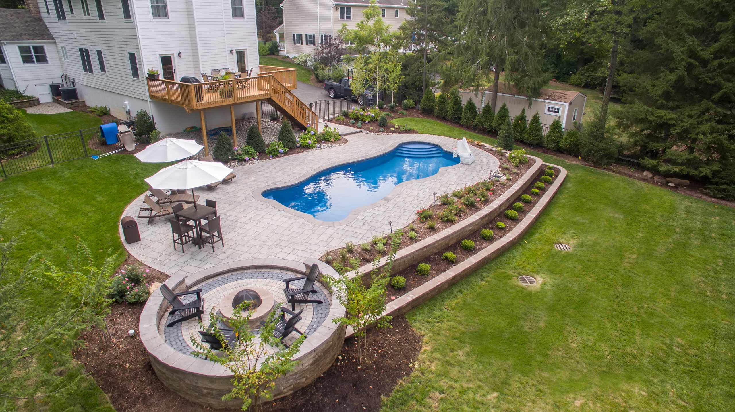 Creating a pool area on a sloped backyard
