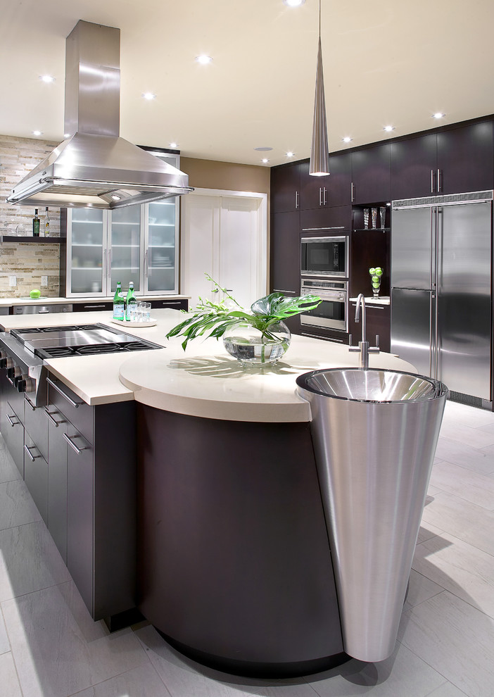 Large modern u-shaped separate kitchen in Montreal with an undermount sink, flat-panel cabinets, dark wood cabinets, quartz benchtops, beige splashback, stone tile splashback, stainless steel appliances, porcelain floors and with island.