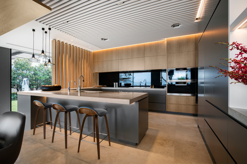 Inspiration for a large contemporary u-shaped eat-in kitchen in Sydney with flat-panel cabinets, brown benchtop, an undermount sink, medium wood cabinets, black splashback, glass sheet splashback, panelled appliances, a peninsula and beige floor.
