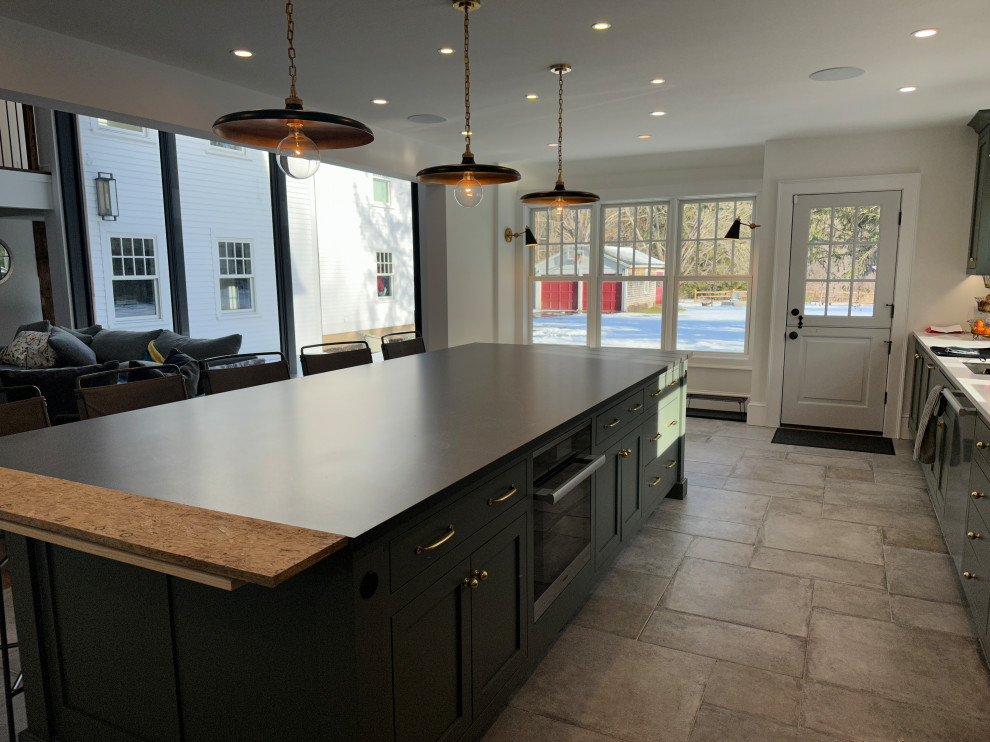 Inspiration for a large transitional kitchen in Boston with beaded inset cabinets, green cabinets, quartz benchtops, white splashback, ceramic splashback, stainless steel appliances and white benchtop.