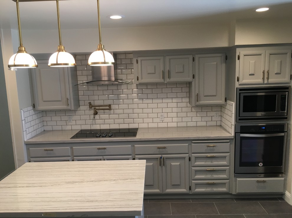 Eat-in kitchen - modern eat-in kitchen idea with raised-panel cabinets and gray cabinets