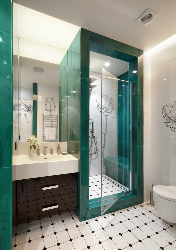 This is an example of a mid-sized contemporary bathroom in Moscow with flat-panel cabinets, black cabinets, a wall-mount toilet, green tile, white tile, ceramic tile, ceramic floors, an integrated sink, solid surface benchtops, an alcove shower and an open shower.