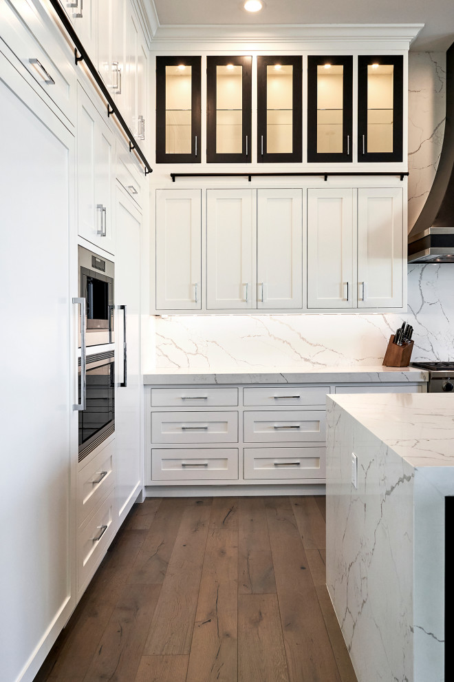 Example of a transitional kitchen design in Phoenix with shaker cabinets and white cabinets