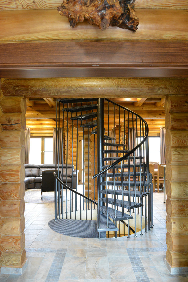 Inspiration for a mid-sized country metal spiral staircase in Other with open risers.