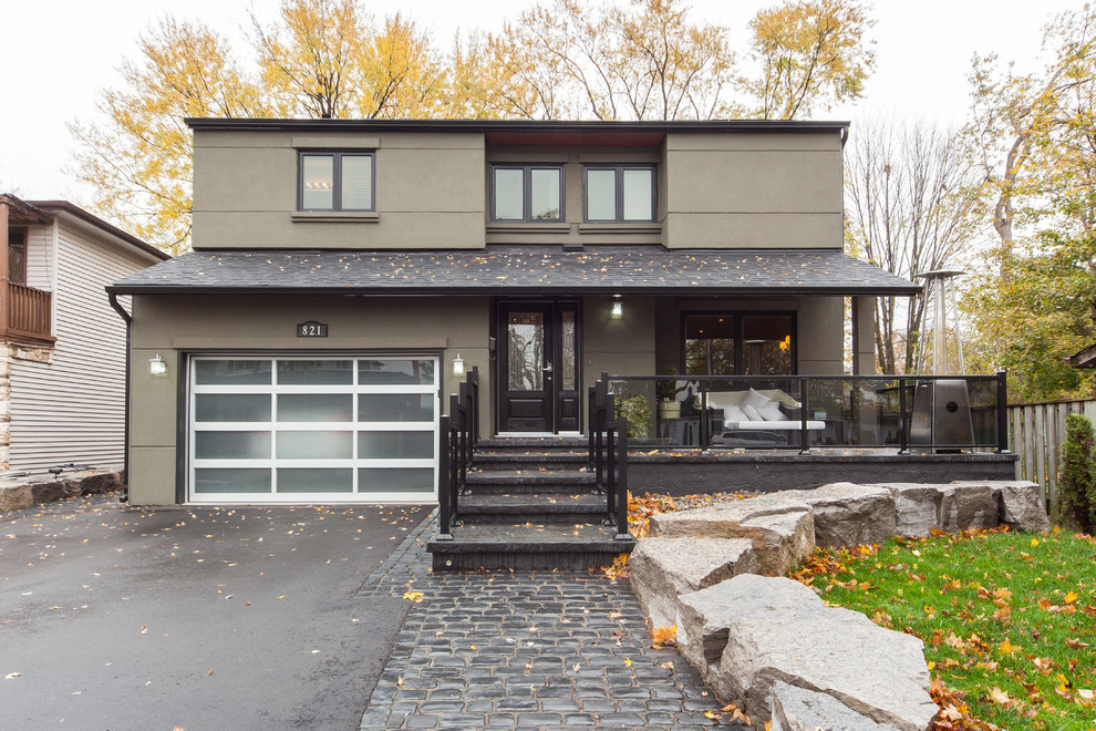 Inspiration for a contemporary two-storey brown exterior in Toronto.