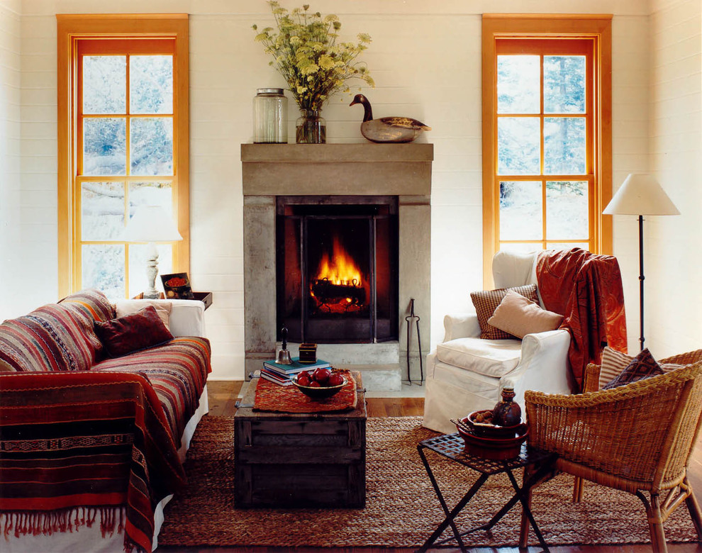 Inspiration for a mid-sized country living room in Seattle with a standard fireplace and beige walls.
