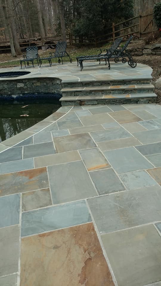 Huge transitional backyard stone and kidney-shaped natural pool photo