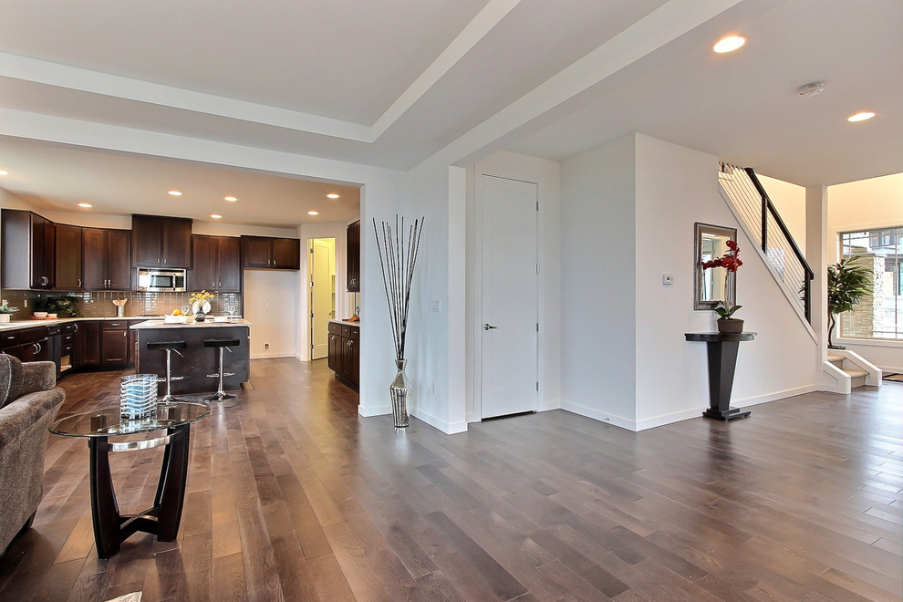 Example of a large transitional hallway design in Seattle with white walls and engineered wood floors