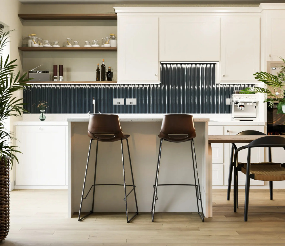This is an example of a Medium Sized bohemian Single-wall kitchen/diner with an Integrated Sink, Recessed-panel Cabinets, Beige Cabinets, Terrazzo Worktops, Blue Splashback, Ceramic Splashback, Stainless Steel Appliances, Laminate Floors, an Island, Beige Floors and White Worktops.