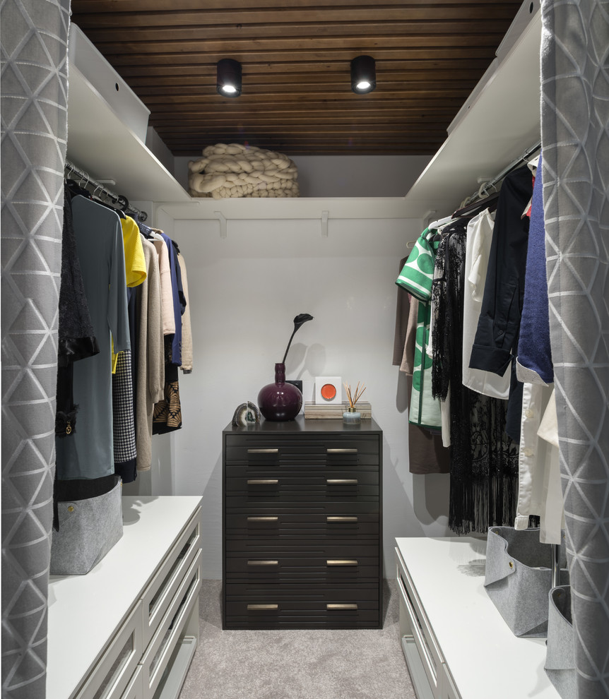 Design ideas for a beach style women's walk-in wardrobe in Other with white cabinets, carpet, grey floor and open cabinets.