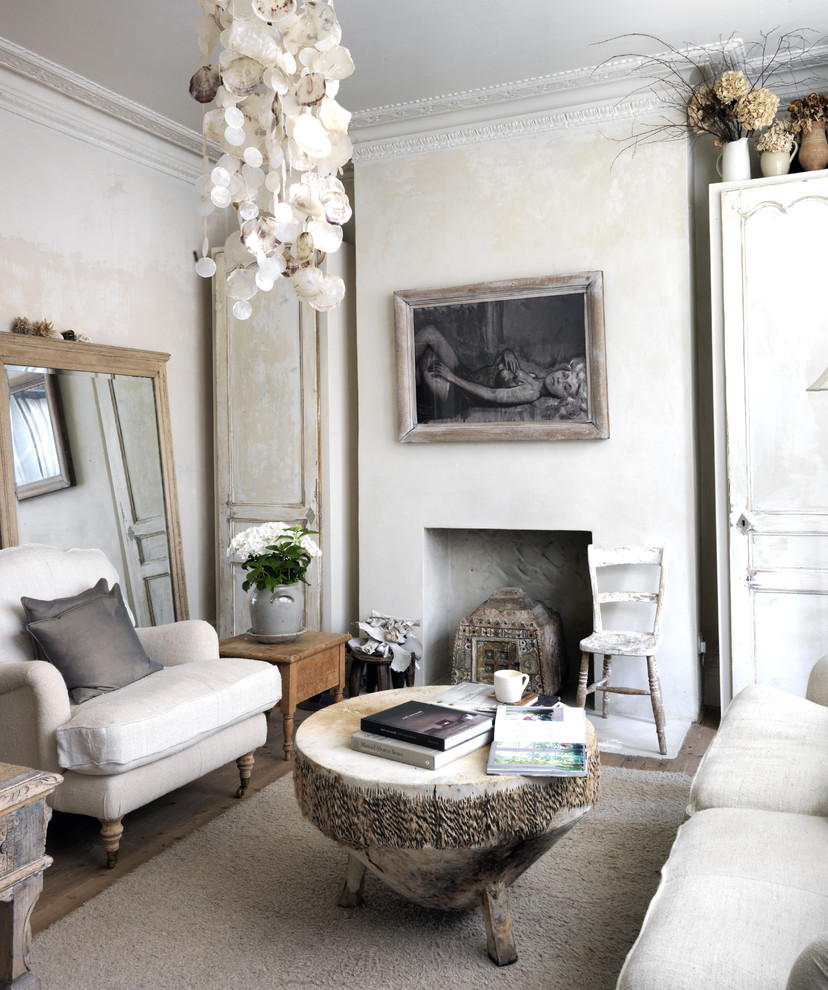 Inspiration for a mid-sized traditional enclosed living room in London with beige walls.