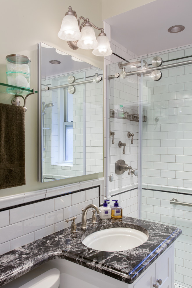 Design ideas for a mid-sized transitional master bathroom in New York with an undermount sink, furniture-like cabinets, white cabinets, marble benchtops, an alcove shower, a two-piece toilet, white tile, ceramic tile, green walls and mosaic tile floors.