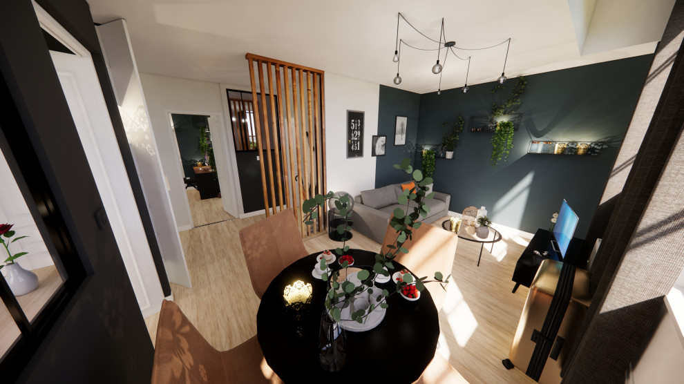 Kleines Industrial Wohnzimmer ohne Kamin mit grüner Wandfarbe, hellem Holzboden, freistehendem TV und beigem Boden in Dijon