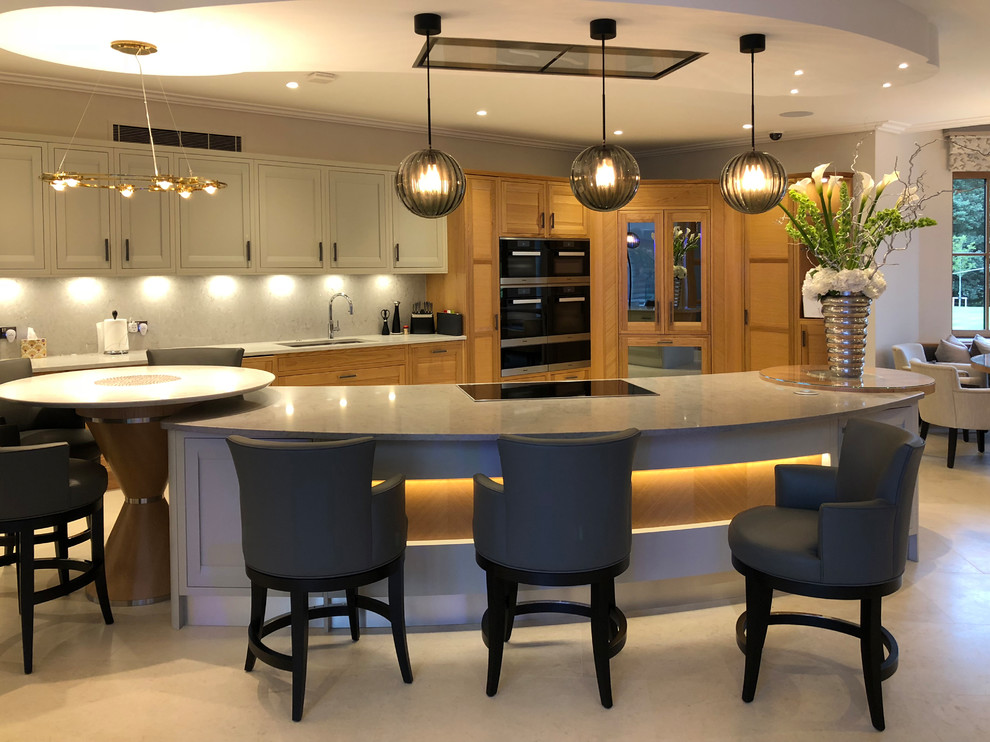 Design ideas for an expansive contemporary u-shaped eat-in kitchen in Other with an undermount sink, recessed-panel cabinets, light wood cabinets, granite benchtops, white splashback, porcelain splashback, black appliances, porcelain floors, multiple islands, beige floor and white benchtop.