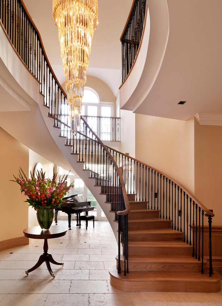 Traditional wood curved staircase in London with wood risers.