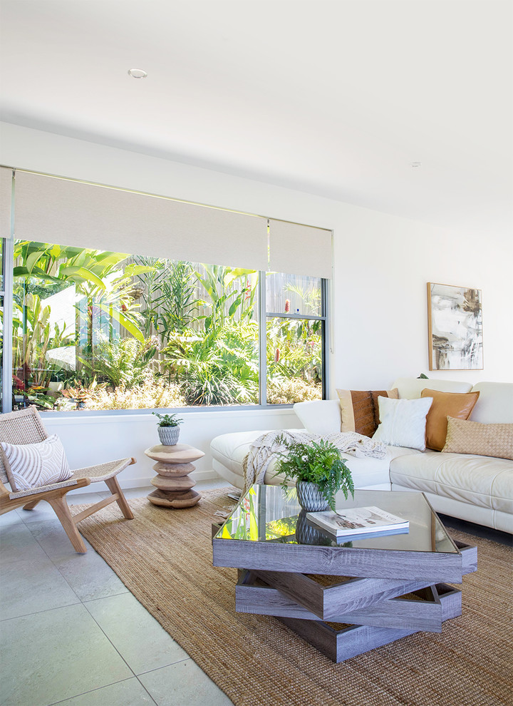 This is an example of a beach style living room in Sunshine Coast.