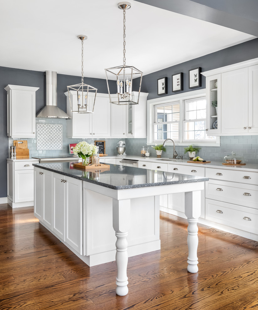 Example of a huge transitional l-shaped dark wood floor and brown floor eat-in kitchen design in Philadelphia with a single-bowl sink, flat-panel cabinets, white cabinets, quartzite countertops, gray backsplash, ceramic backsplash, stainless steel appliances, an island and white countertops