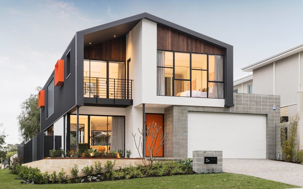 Large contemporary two-storey grey house exterior in Perth with metal siding, a gable roof and a metal roof.