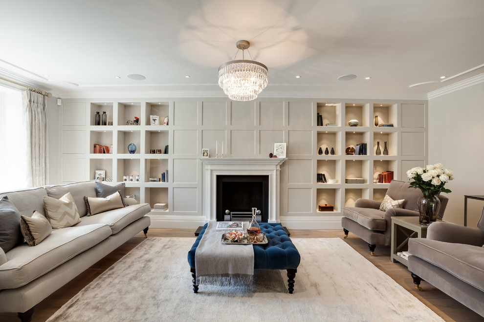 This is an example of a large contemporary formal living room with grey walls and light hardwood floors.