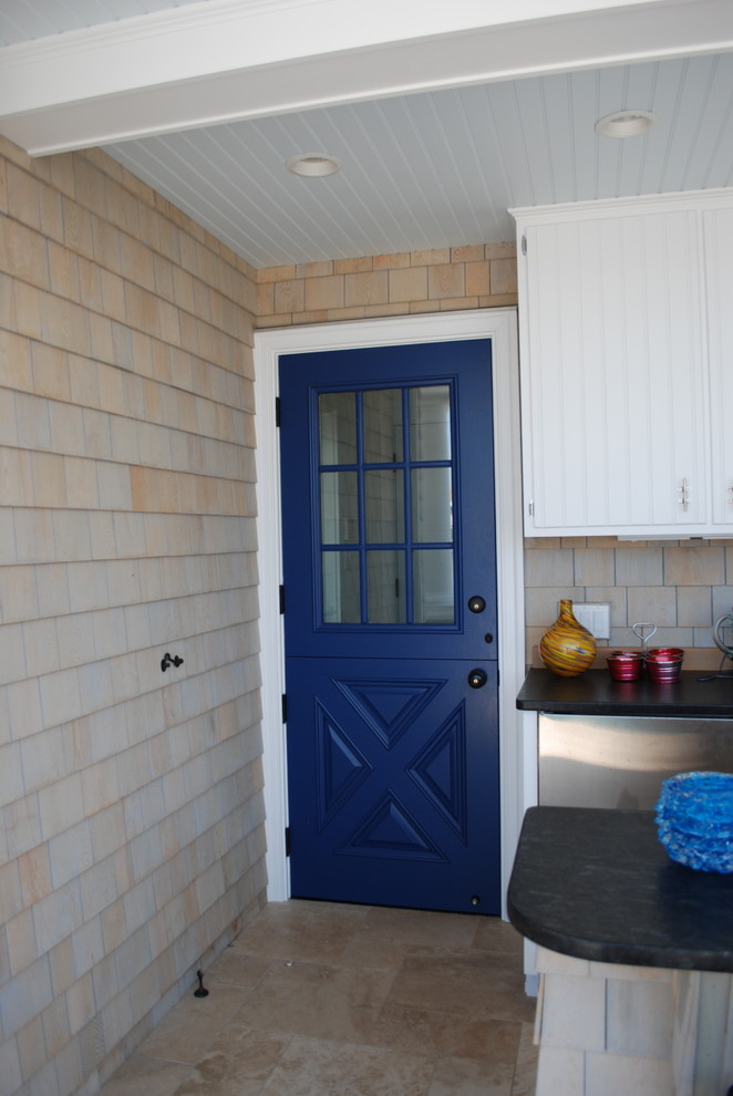 Photo of a country entryway in Other with a dutch front door and a blue front door.