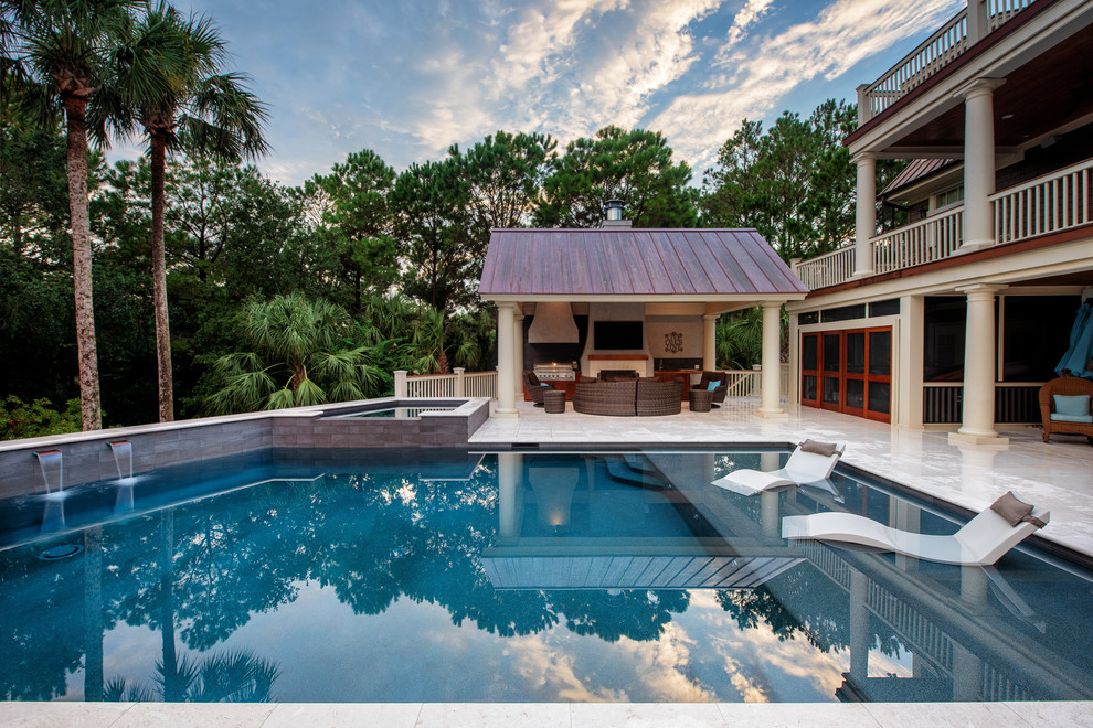 Beach style backyard rectangular pool in Charleston with a hot tub.