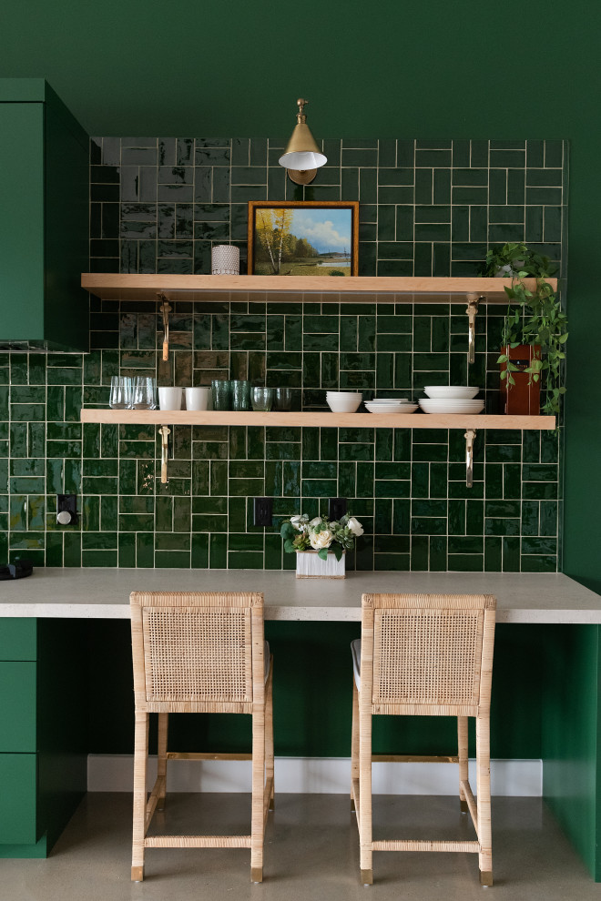 Inspiration for a small contemporary single-wall kitchen in Houston with a single-bowl sink, flat-panel cabinets, green cabinets, green splashback, subway tile splashback, panelled appliances and concrete floors.