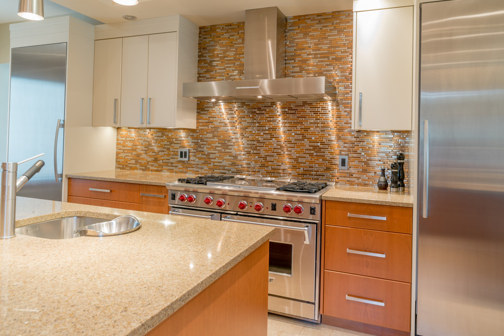 Inspiration for a large transitional porcelain tile eat-in kitchen remodel in Calgary with an undermount sink, flat-panel cabinets, medium tone wood cabinets, metallic backsplash, stainless steel appliances and an island