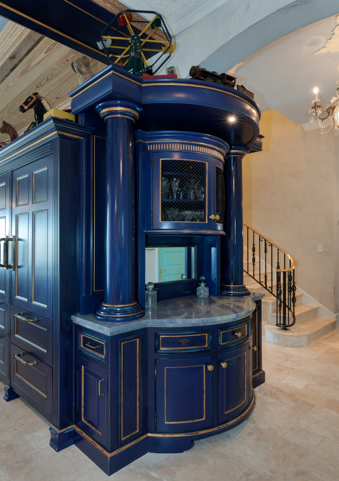 На фото: огромная параллельная кухня в средиземноморском стиле с обеденным столом, с полувстраиваемой мойкой (с передним бортиком), фасадами с выступающей филенкой, синими фасадами, мраморной столешницей, серым фартуком, фартуком из мрамора, техникой под мебельный фасад, полом из керамической плитки, двумя и более островами, бежевым полом, серой столешницей и кессонным потолком с