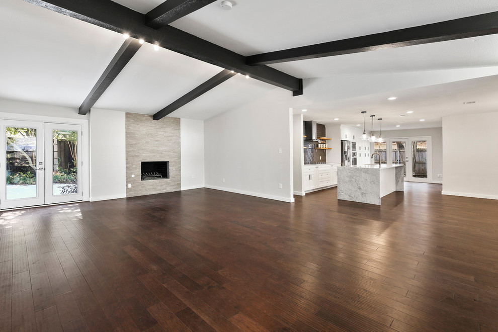 Large transitional formal and open concept dark wood floor and brown floor home design photo in Dallas with gray walls, a standard fireplace, a tile fireplace and no tv