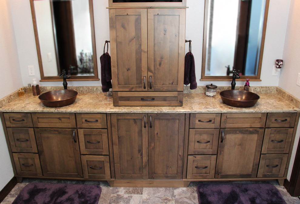 This is an example of a large country master bathroom in Other with shaker cabinets, medium wood cabinets, white walls, a vessel sink and granite benchtops.