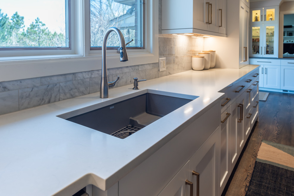 Example of a transitional kitchen design in Denver