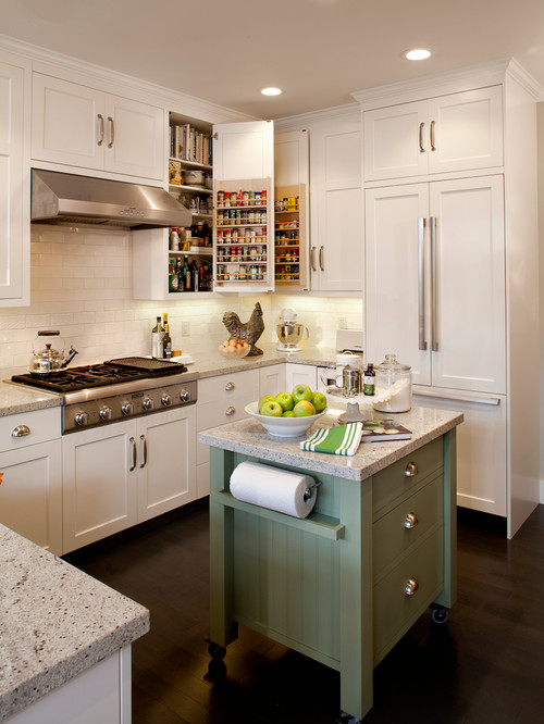 Bright Kitchen Cabinet Mississauga space with white shaker cabinets, built-in pantry storage, stainless steel range hood, and a green rolling island cart.