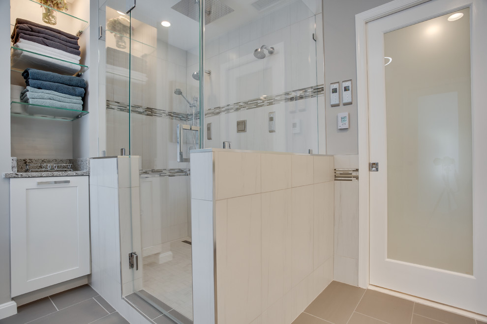 Design ideas for a large transitional master bathroom in DC Metro with shaker cabinets, white cabinets, a freestanding tub, an alcove shower, grey walls, an undermount sink, granite benchtops and grey floor.
