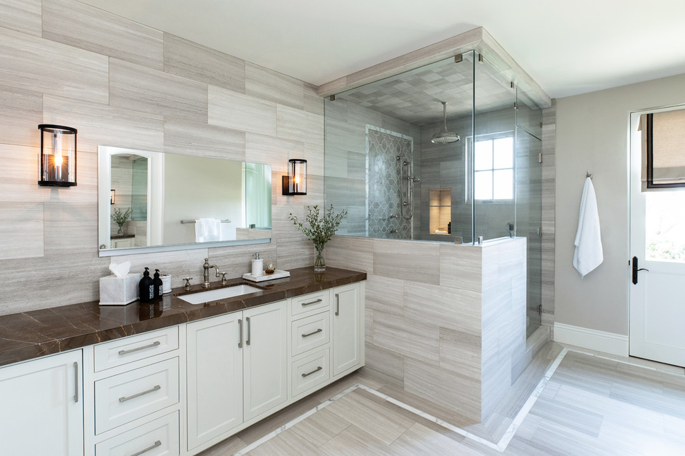 Mid-sized transitional master bathroom in San Diego with white cabinets, gray tile, marble, grey walls, marble floors, an undermount sink, marble benchtops, grey floor, a hinged shower door, brown benchtops, shaker cabinets and a corner shower.