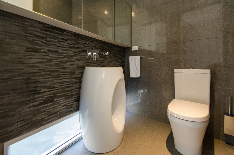 Beach style powder room in Melbourne.