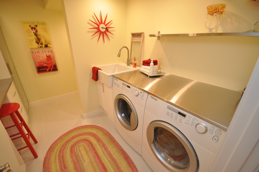 Inspiration for a traditional laundry room in Vancouver with stainless steel benchtops.