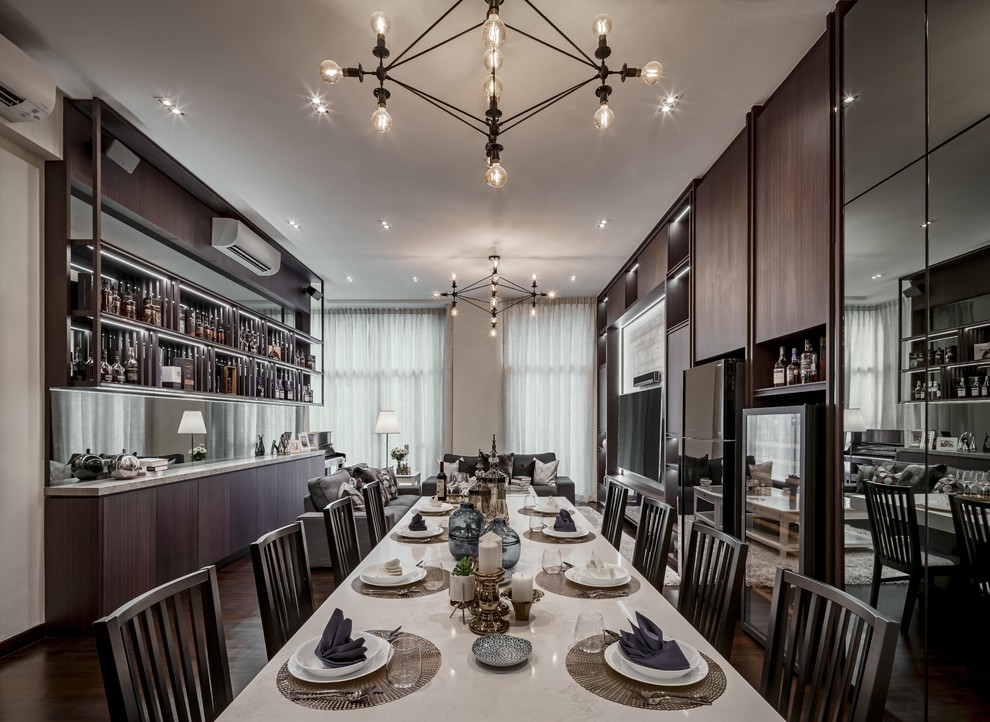 This is an example of a contemporary dining room in Singapore with grey walls, dark hardwood floors and brown floor.