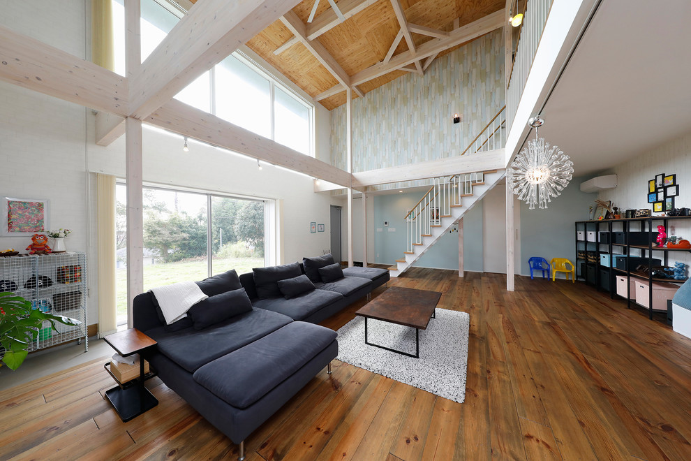 This is an example of an industrial living room in Other with dark hardwood floors.